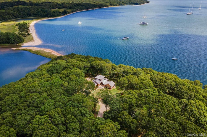 Aerial view of property looking towards Mashomack Preserve and surrounding Waterfront