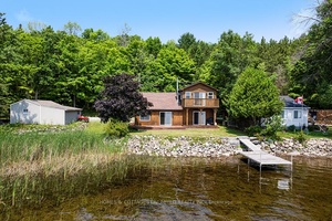 Nestled on the tranquil north shore of Dalhousie Lake, this well maintained, partially furnished home or cottage is move in ready just in time for summer memories.