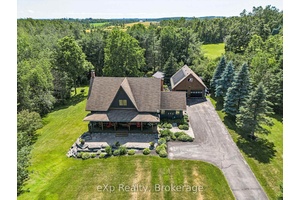 Welcome to this one of a kind, Hutley built custom log home, nestled on a serene and park like country lot just minutes from Shanty Bay and Heritage Hills Golf ...