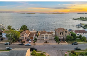 Nestled on the open bay in Baldwin, this stunning 4 bedroom, 2.