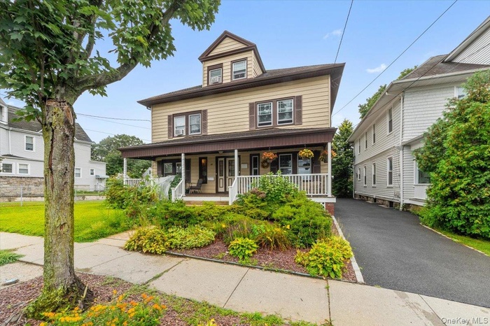 Traditional style home featuring a porch