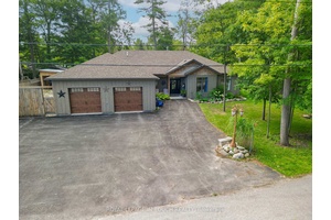 Welcome to 1 Spruce Street in Tiny Township a beautifully maintained, single level gem offered for the first time.