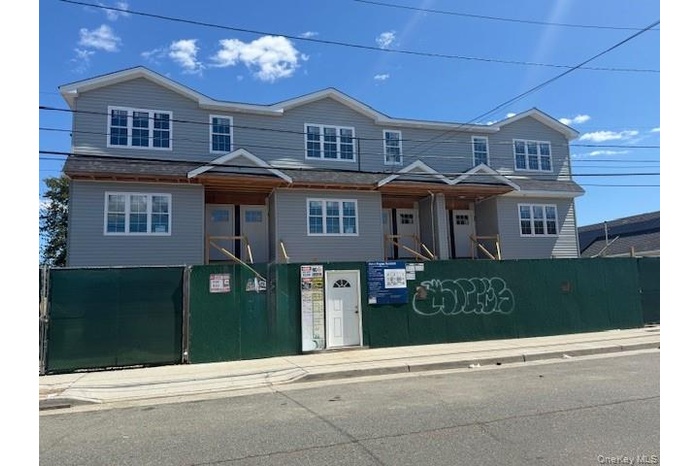 Traditional home with a fenced front yard
