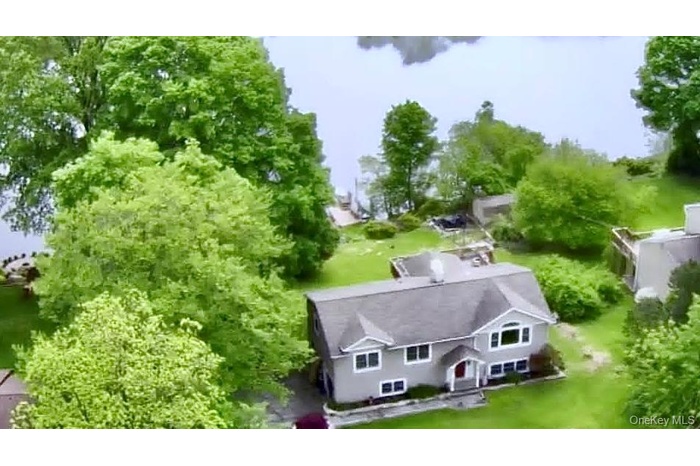 View of property and lake