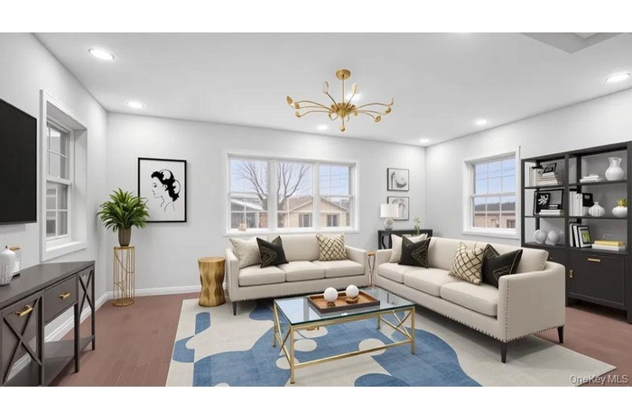 Living room with wood finished floors, recessed lighting, healthy amount of natural light, and a chandelier