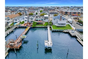 Oversized waterfront property offering landscaped privacy in the front and breathtaking open bay views with spectacular sunsets in the rear.