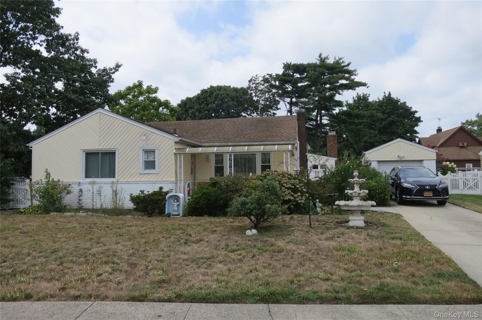 View of front of property featuring roof with shingles