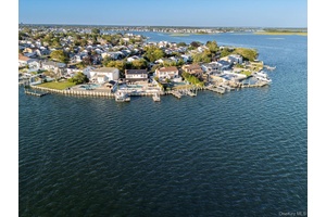 Welcome to one of Baldwin Harbor s most extraordinary waterfront properties an outdoor enthusiast s dream and a rare opportunity to own a truly one of a kind coastal retreat.