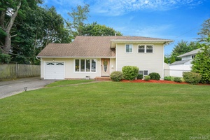 Welcome to this charming split level home featuring 3 bedrooms and 1.