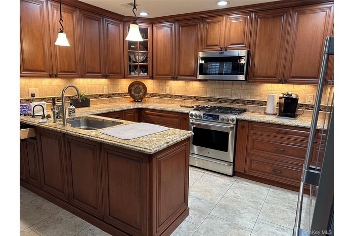 Raised panel cherry cabinets and granite countertops