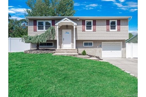 Located in the heart of Selden, this beautifully renovated 4 bedroom, 2 bath home blends modern sophistication with everyday comfort.