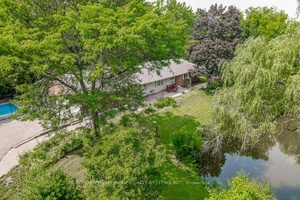 Rare, beautifully treed property offering serene natural beauty and privacy on 1.