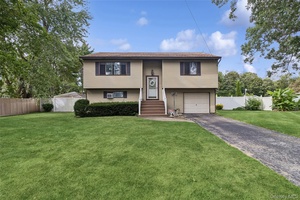 Welcome to this Spacious Hi Ranch located on just shy Half Acre.