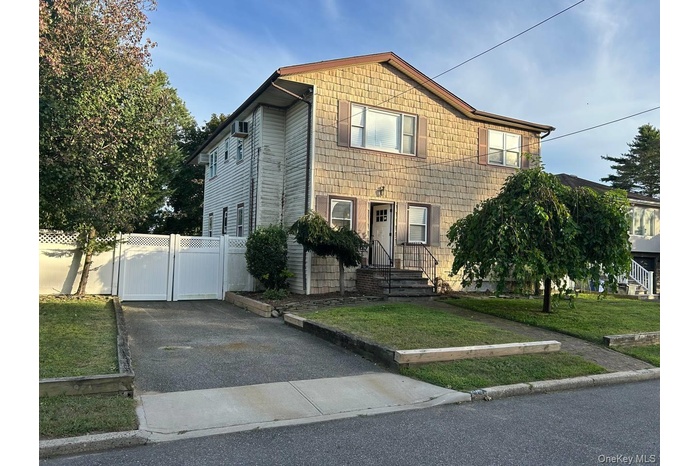 View of front of house with a gate