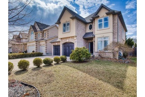 xquisitely crafted custom built executive home nestled on a quiet court.