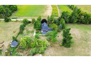 This timeless and stately 1905 farmhouse offers a rare blend of architectural beauty, rural charm, and modern functionality.