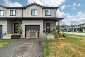 Modern 2 storey townhouse on a spacious corner lot with a fully fenced backyard and attached garage.