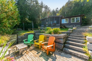 Mid Century Modern Cottage Charm on Four Mile Lake !