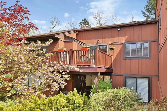 Top floor single-level end unit with West facing deck overlooking the cherry tree