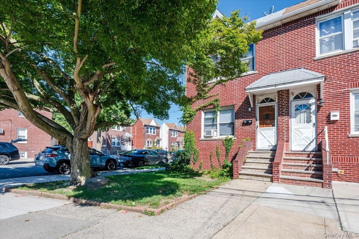 View of front of house with brick siding and entry steps