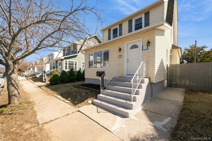View of front facade featuring fence