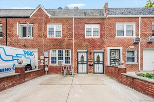 Welcome to this Move in brick attached 2 family home in Ozone Park, Queens.