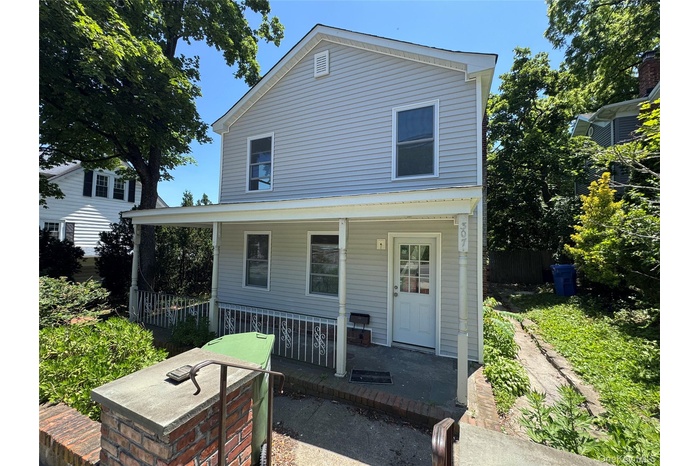View of front of house with covered porch