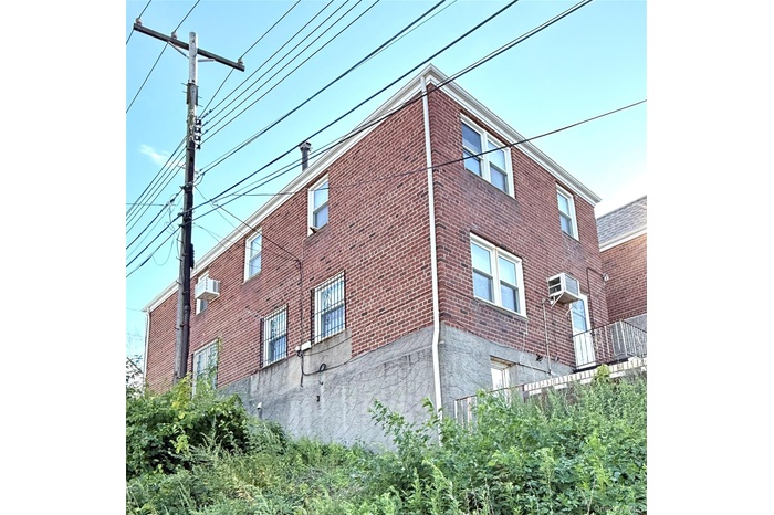 View of side of home with brick siding
