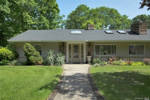 Peace and privacy abound at this spacious ranch on 3 acres of a nature lover's paradise.
