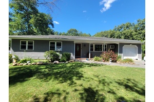 Welcome to this beautifully 3 bedroom, 2 bathrooms ranch nestled on a spacious 0.