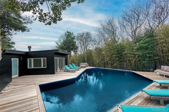 View of pool with a deck