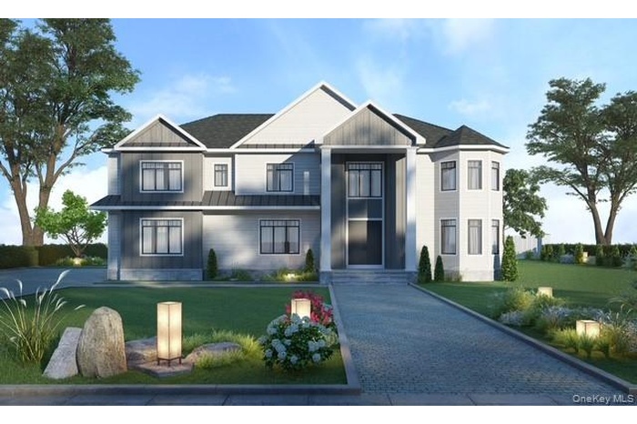 View of front of property with a front lawn and board and batten siding