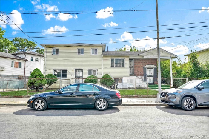 Tri-level home with a fenced front yard