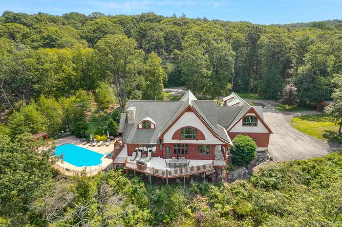 View of subject property with a heavily wooded area