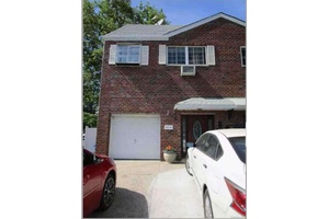This is a 2 family brick house located in the heart of College Point.