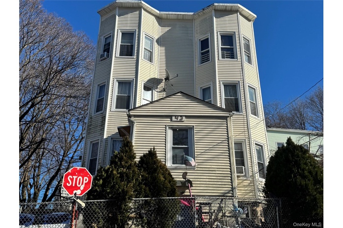 View of side of property with a fenced front yard