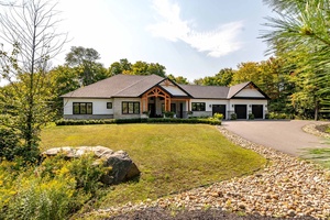 Welcome to this sprawling executive bungalow in the highly desirable Woodland Heights community.