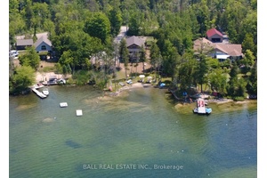 PRIVACY, SUNSETS, SAND BEACH Stunning custom lakehouse that has 2 complete living spaces and triple car garage on beautiful Julian Lake !