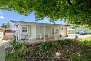 Welcome to this cozy year round home in Maple Leaf Acres.
