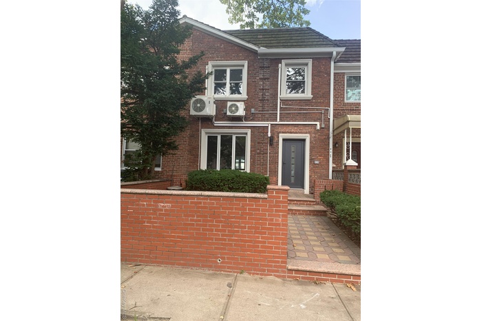 View of front of home with brick siding