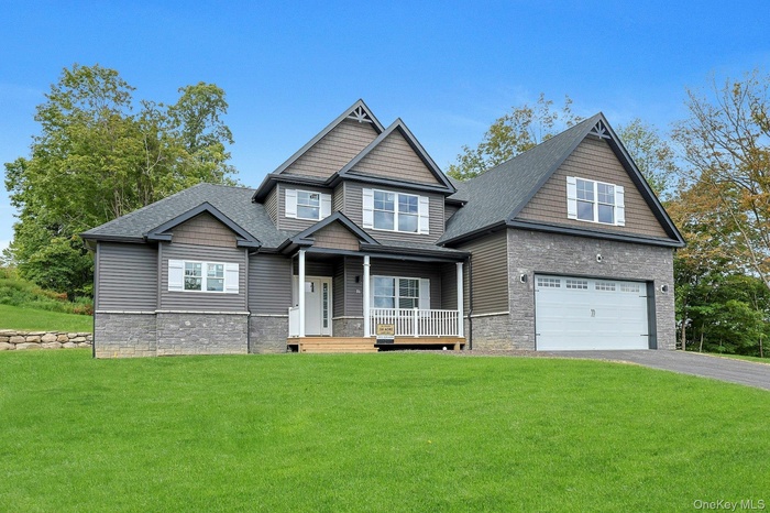 Craftsman inspired home with cultured stone accents on a premium lot