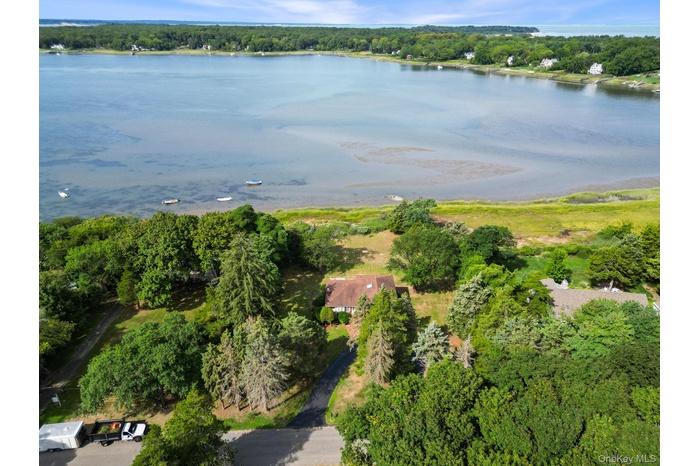 Aerial overview of property's location featuring a large body of water
