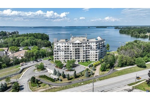 Welcome to this beautifully updated 2 bedroom, 2 bathroom end unit condo, perfectly positioned to offer panoramic water views from nearly every room.
