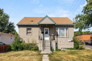 Welcome to 105 Jolliet Avenue A RENOVATED DUPLEX with a third non conforming unit, ideally located just steps from Beechwood Village.