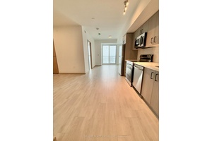 Bright, south facing 1 1 den on the10th floor with balcony, 1 parking, and 1 locker.