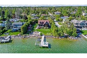 FULLY RENOVATED WATERFRONT MASTERPIECE WITH 100 FT OF PRIVATE SHORELINE, A LUXURY GUEST HOUSE, amp ; METICULOUSLY LANDSCAPED RESORT STYLE GROUNDS !