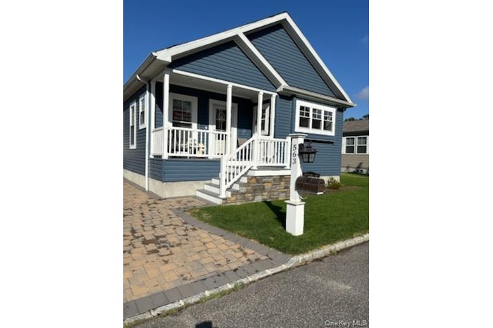 View of front of house with covered porch