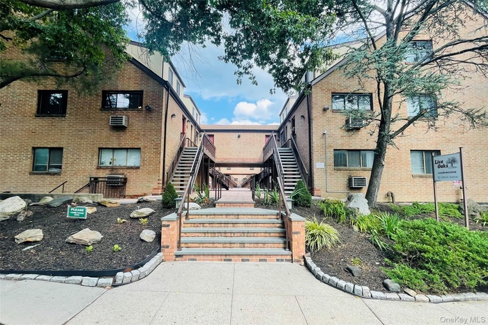 View of property with stairway