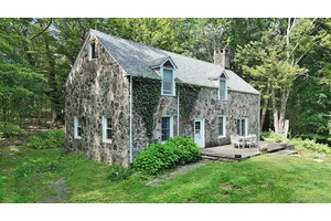 Welcome to this beautiful country estate which offers deep seclusion, rolling meadows and over 1, 000 feet of frontage on a large year round trout stream.