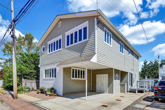 Traditional-style house featuring brick siding